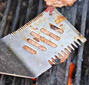 Smashing burgers on the grill