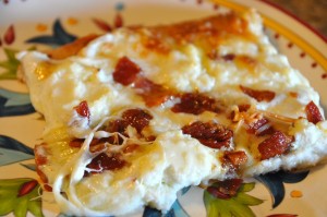 slice of cheese and bacon pizza