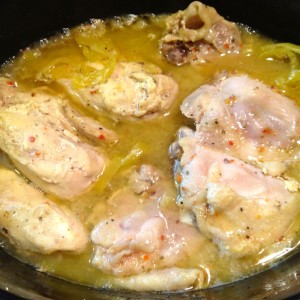 Cooked pieces of Italian Chicken in the crock pot