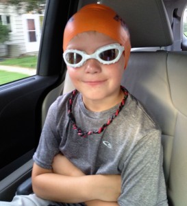 boy in swim cap boy in swim cap