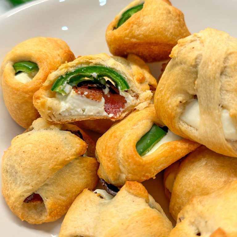 This unique jalapeño popper recipe is just four ingredients - crescent rolls, cream cheese, bacon, and jalapeños.