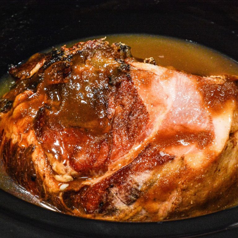 Crock Pot Holiday Ham is slow cooked in brown sugar, maple syrup, and pineapple juice making this crock pot maple ham perfect for the Thanksgiving or Christmas dinner table.