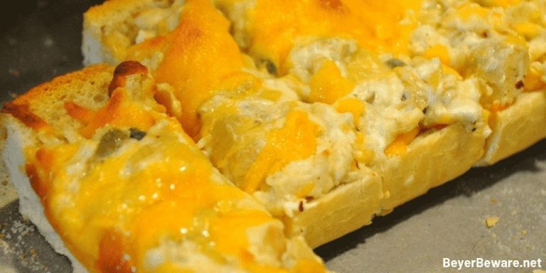 Cheesy Artichoke Bread is a simple appetizer combining artichoke hearts with lots of cheese, garlic, and onions on Italian bread for perfect finger food for any party. #Appetizers #Artichokes #Cheese #CheesyBread