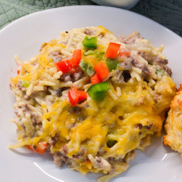 Cheesy and comforting, this Creamy Hamburger Spaghetti Casserole is the perfect weeknight dinner. Made with ground beef, spaghetti, cream cheese, and Colby-Jack cheese, it's easy and delicious!