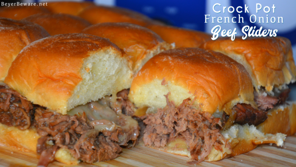 Crock Pot French onion shredded beef sliders recipe is a shredded French onion beef roast made with canned French onion soup, onions, butter and beef broth used to make cheesy sliders on Hawaiian rolls.