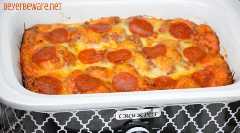 After three hours this crock pot bubble up pizza casserole was a cheesy goodness filled with our favorite pizza toppings. It is the perfect way to make a weeknight meal when you can't be home to put the casserole in the oven.