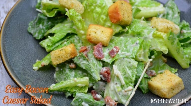 Easy bacon caesar salad is a simple combination of the basic Caesar salad ingredients of romaine lettuce, parmesan cheese, caesar dressing and croutons and taken up a notch with the addition of bacon.