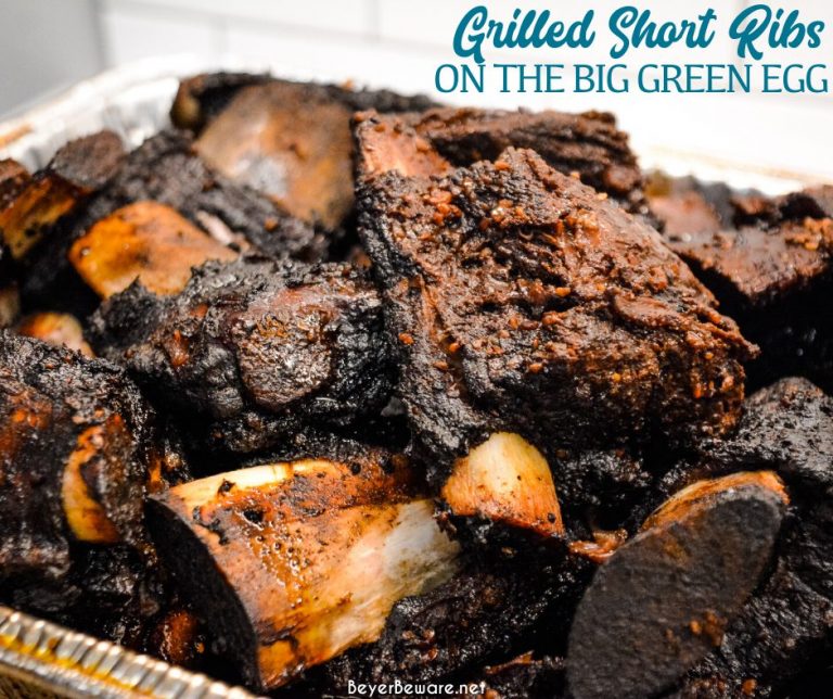 Grilled beef short ribs on the Big Green Egg are smoked with a beef barbecue rub and then slow-cooked to their final temperature in a bath of red wine, butter, and beef broth. 