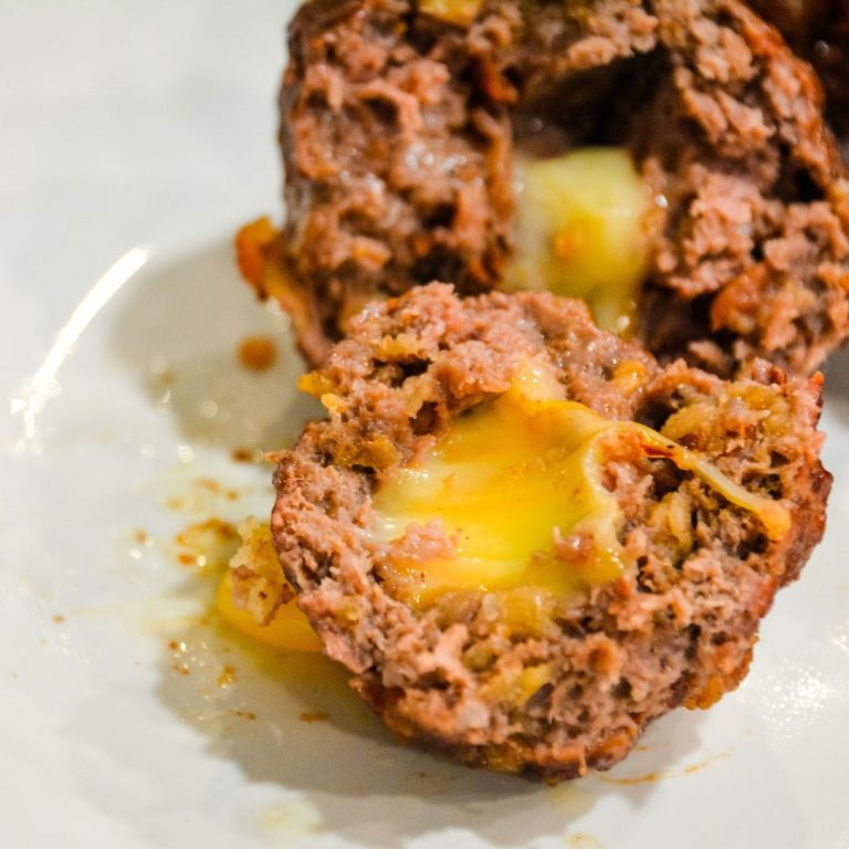 Bacon cheeseburger stuffed meatballs on the grill are the perfect grilled meatball made with bacon bits, fried onions, ground beef, and a cube of Colby jack cheese.