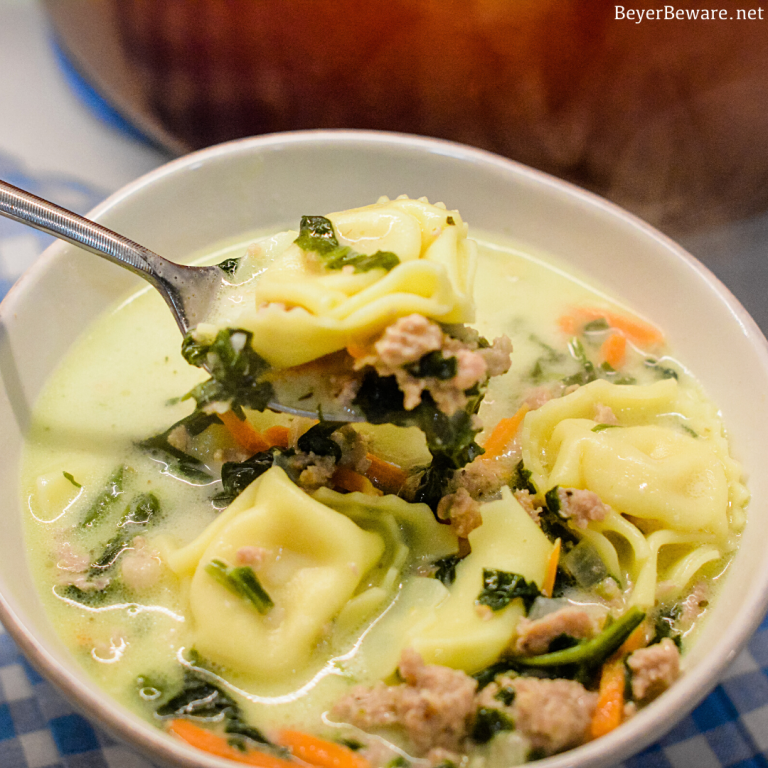 Sausage Tortellini Soup with spinach is a quick soup made on the stove all in one pot for a hearty, creamy soup full of spinach, sausage and cheese tortellini for an Italian sausage tortellini soup.