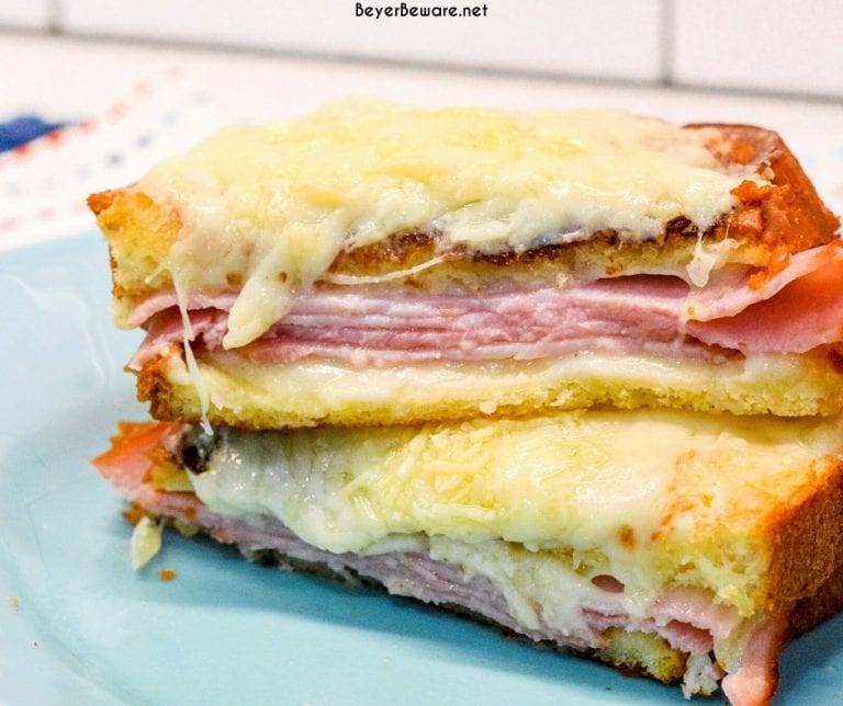 Croque Monsieur is an over the top grilled ham and cheese sandwich recipe that is made with King's Hawaiian bread, Smithfield smoked ham, swiss and gruyere cheese, and a mustard Bechamel sauce.