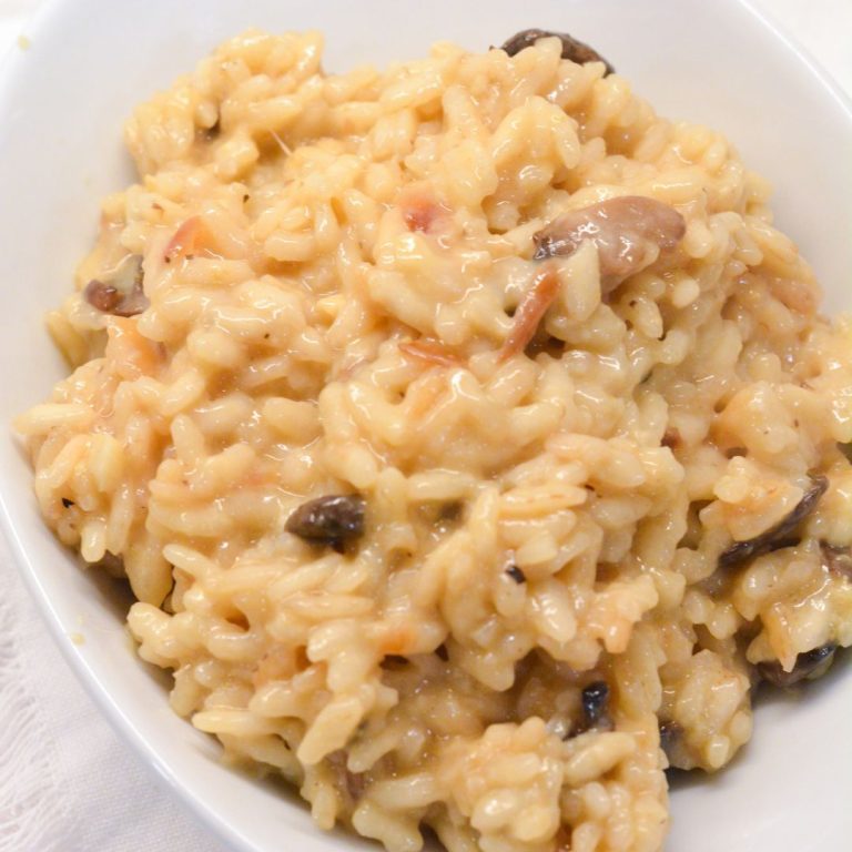 This mushroom risotto recipe is made with arborio rice, white wine, garlic, onions, mushrooms, and parmesan cheese.