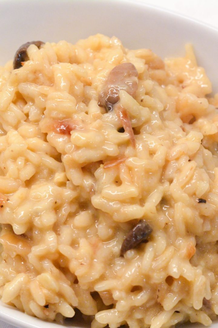 This mushroom risotto recipe is made with arborio rice, white wine, garlic, onions, mushrooms, and parmesan cheese.
