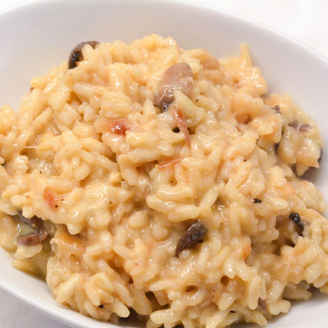 This mushroom risotto recipe is made with arborio rice, white wine, garlic, onions, mushrooms, and parmesan cheese.