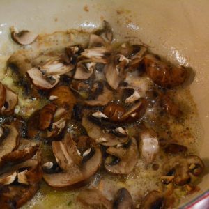 Add the sliced mushrooms to the skillet, season with salt and pepper, and cook until they are tender and golden brown, about 5-7 minutes.