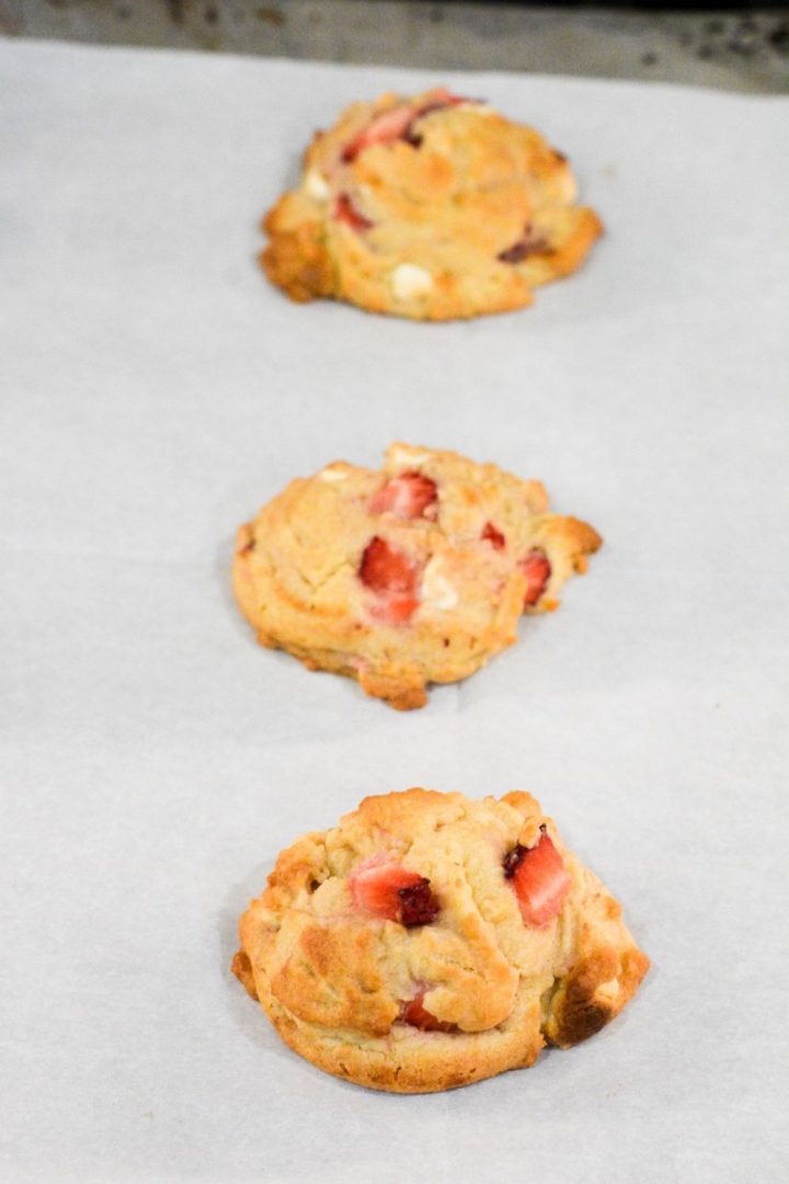 Keep the strawberry cheesecake pudding cookies on the baking sheet for a few minutes before transferring to a newspaper lined counter for cooling.