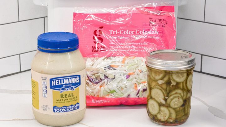 The creamy Pickle Coleslaw recipe ingredients are shredded cabbage, pickles, pickle juice, and mayonnaise.