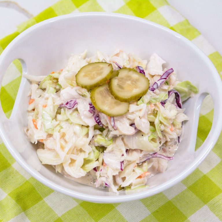 The creamy Dill Pickle Coleslaw recipe is made with shredded cabbage, pickles, pickle juice, and mayonnaise.