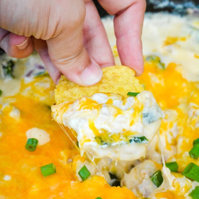 This smoked corn dip is made on your smoker or in your oven with ground pork, roasted poblanos, cream cheese, shredded cheddar cheese, and adobo seasoning.