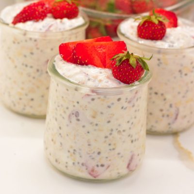 Strawberry cheesecake overnight oats will become your new morning favorite and can be made in 5 minutes with oats, fresh strawberries, power core vanilla protein milk, and cream cheese.