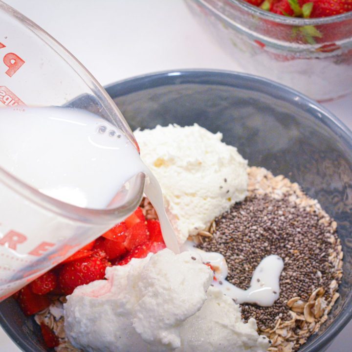 Add Other Ingredients: Add chia seeds, Greek yogurt, cream cheese, and strawberries. Pour the milk and honey over the top. Stir well until all the ingredients are fully combined, and the mixture is smooth.