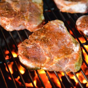 The best grilled pork chops are made with a simple dry rub with a combination of smoked paprika, brown sugar, onion and garlic powder, salt, and pepper. These pork chops are to die for.