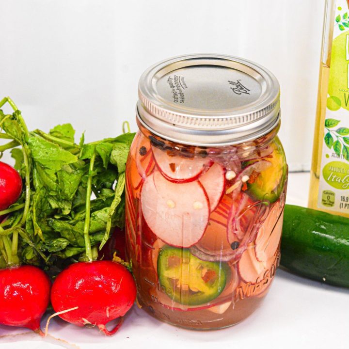 These refrigerator spicy pickled radishes are an easy pickled radish recipe made with fresh radishes, jalapenos, red onions, white wine vinegar, salt, sugar, and spices.