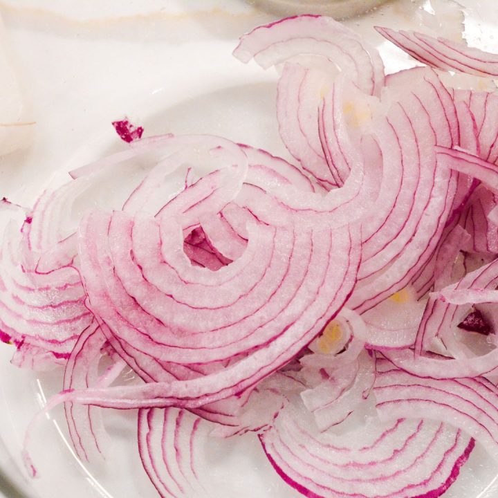 Slice the onions, jalapenos, and garlic to be combined with the radishes.