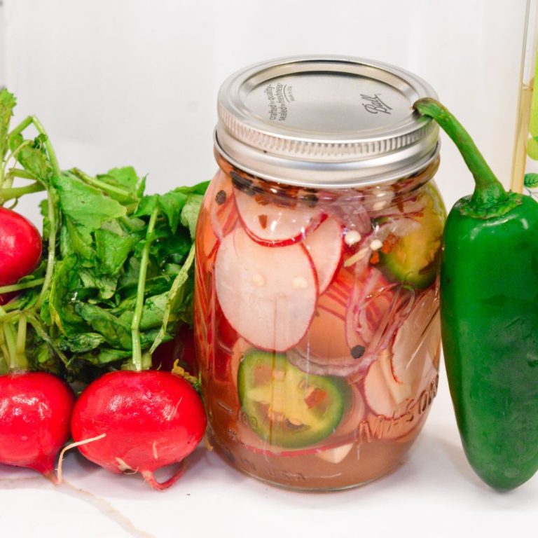 These refrigerator spicy pickled radishes are an easy pickled radish recipe made with fresh radishes, jalapenos, red onions, white wine vinegar, salt, sugar, and spices.