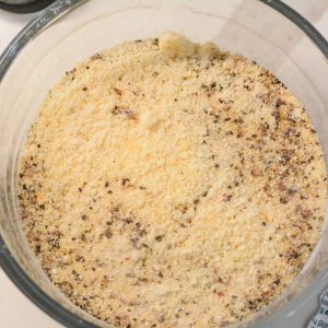 In a large bowl, combine Parmesan cheese and Italian dressing mix. Mix well until it is completely combined throughout.