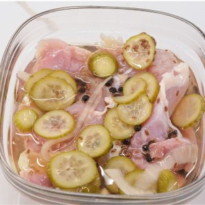 Brine the Chicken: Place the chicken in a large bowl or bag with the brine of pickle juice, pickles, onions, garlic, peppercorns, and olive oil. Make sure the chicken is fully submerged in the liquid.