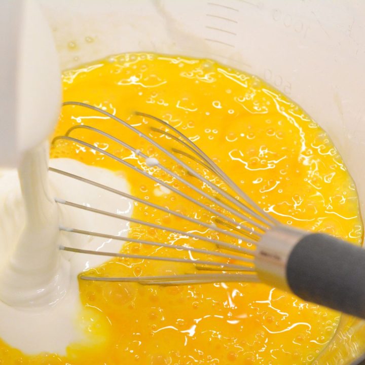 In a large mixing bowl, whisk together the eggs, cottage cheese, salt, and pepper. Make sure the mixture is well combined.