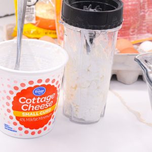 Puree the cottage cheese into a smooth mixture in a blender.