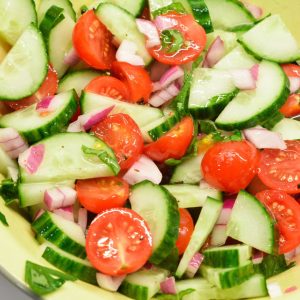 Cucumber and tomato salad is the perfect summer salad with homemade dressing that can be a high protein cucumber, tomato, and onion salad with cottage cheese.