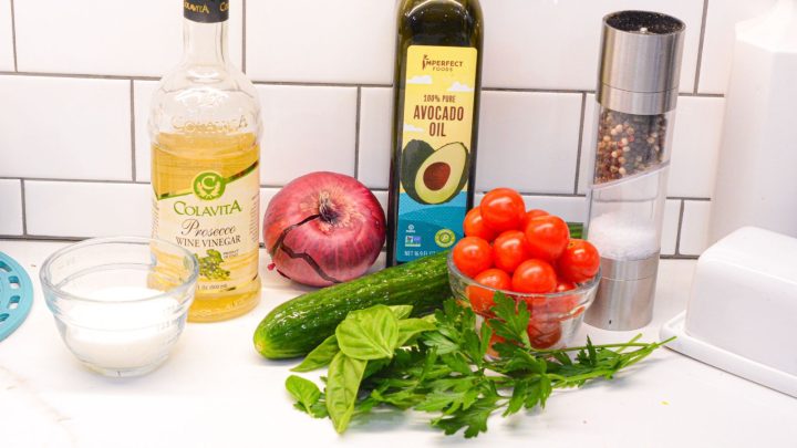 Cucumber, tomato, and onion salad with cottage ingredients - cucumbers, tomatoes, onions, white wine vinegar, olive oil, salt, pepper, basil, parsley, and sugar.