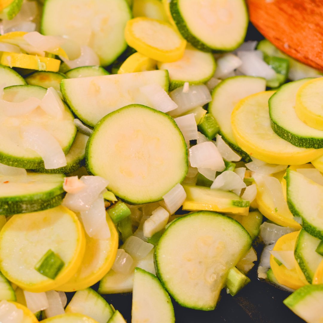 Heat the olive oil in a large skillet over medium heat. Add the onion and garlic then sauté until fragrant, about 1 minute. Add the chopped jalapeño and cook for an additional minute. Add the sliced zucchini, yellow squash, and corn kernels to the skillet.