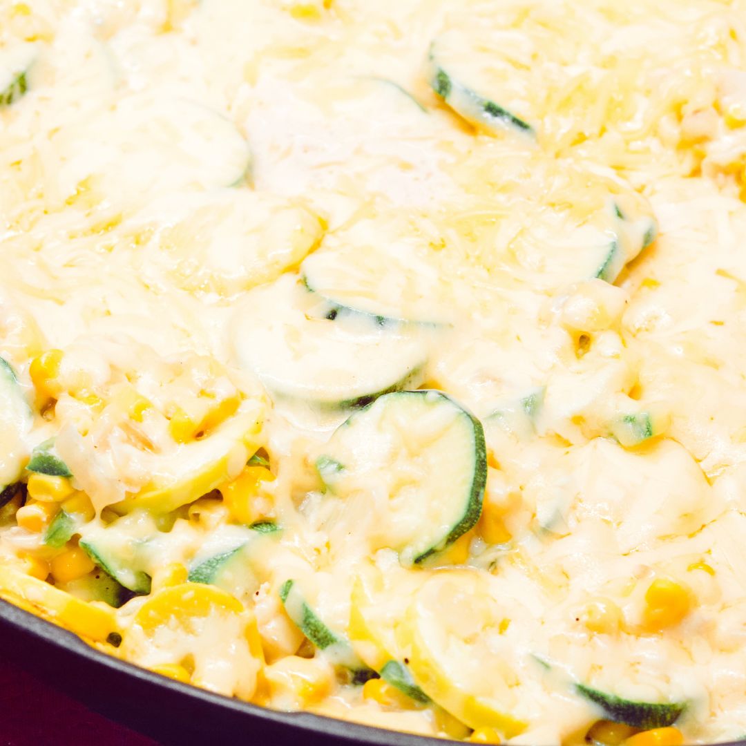 Sprinkle the shredded cheese over the vegetables. Cover the skillet and allow the cheese to melt, about 2-3 minutes.