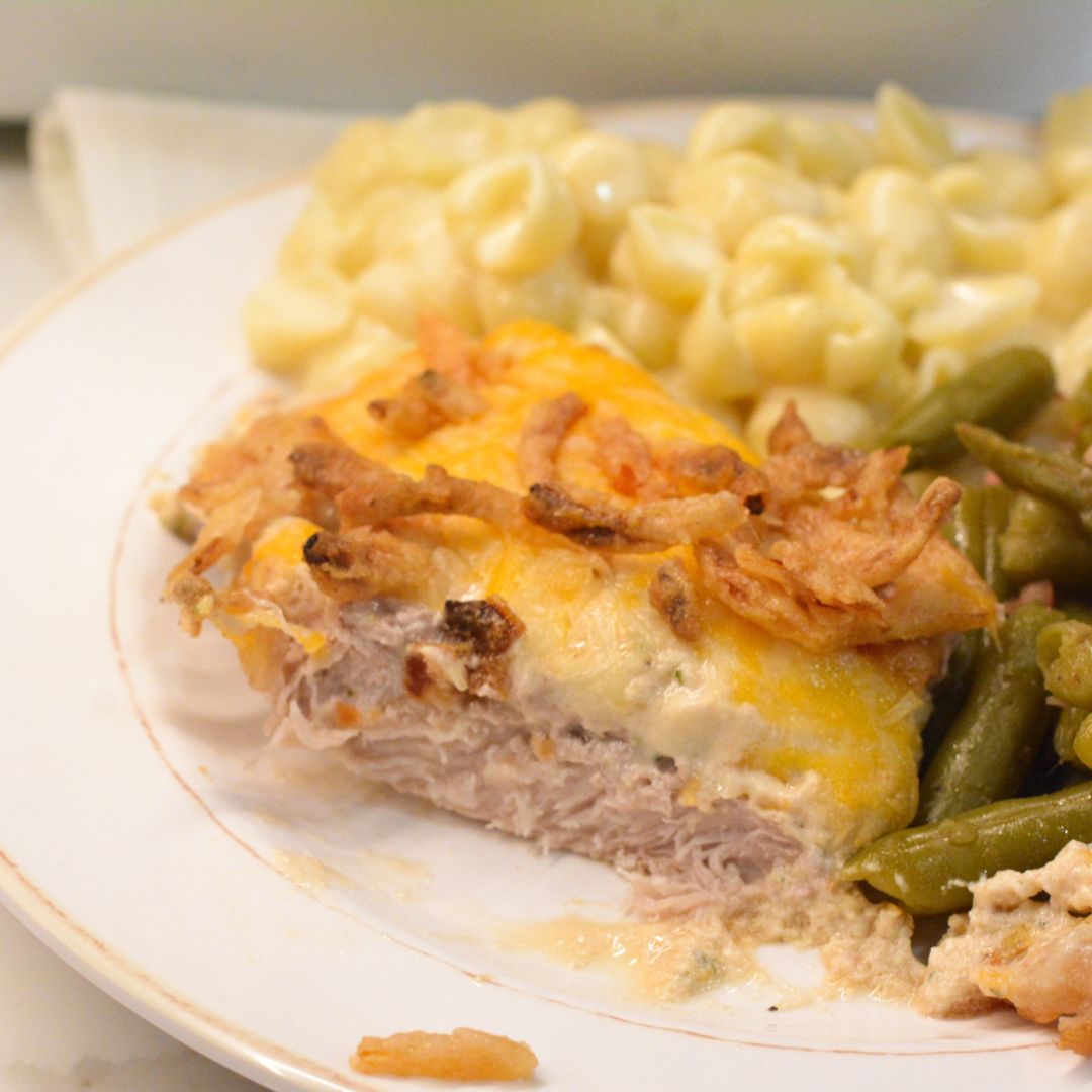 Discover an easy and delicious recipe for easy oven baked pork chops topped with ranch, Colby Jack cheese, and crispy French fried onions. 