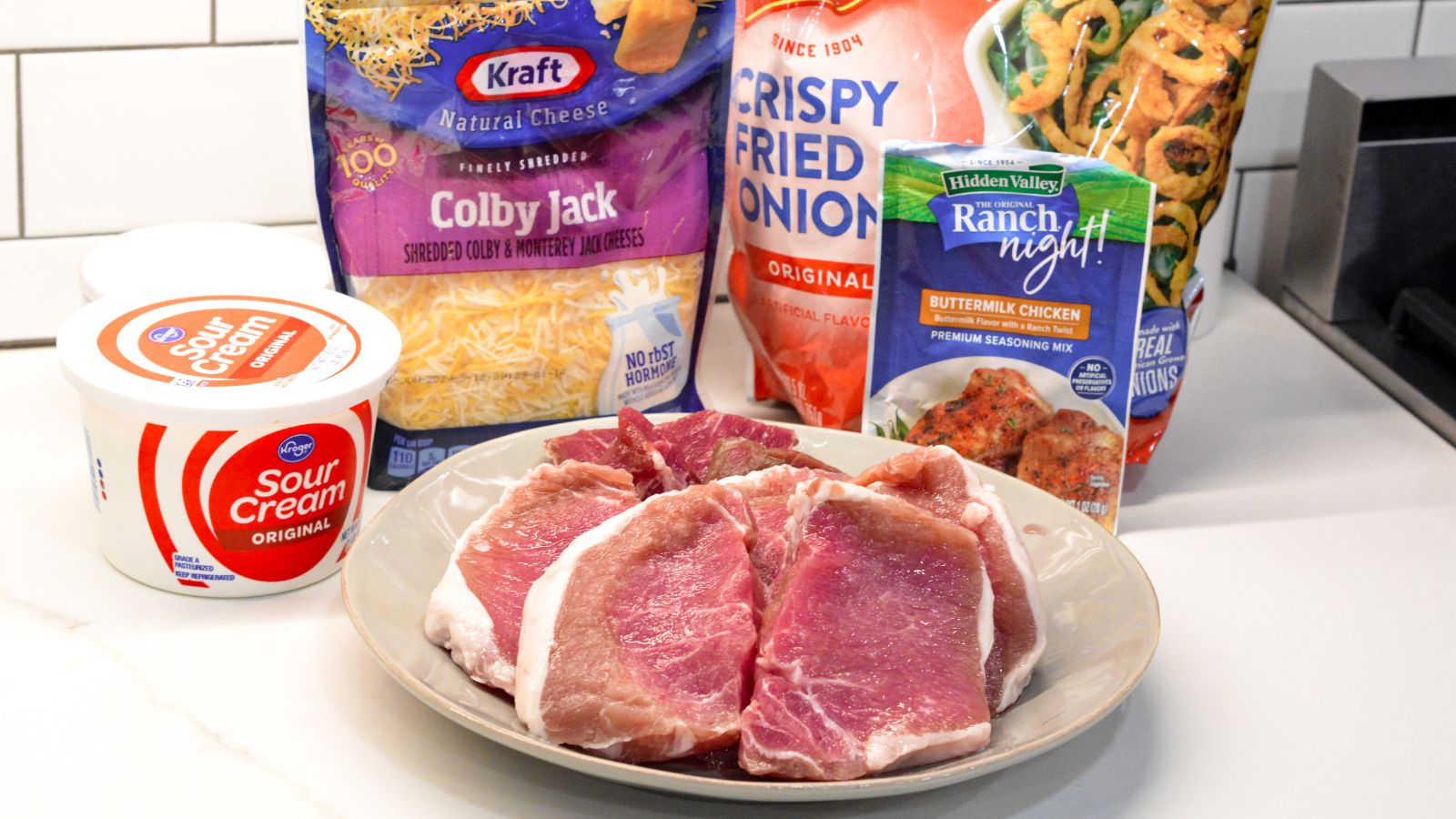 Ranch pork chops ingredients - boneless pork chops, sour cream, ranch seasoning, colby jack cheese, crispy fried onions