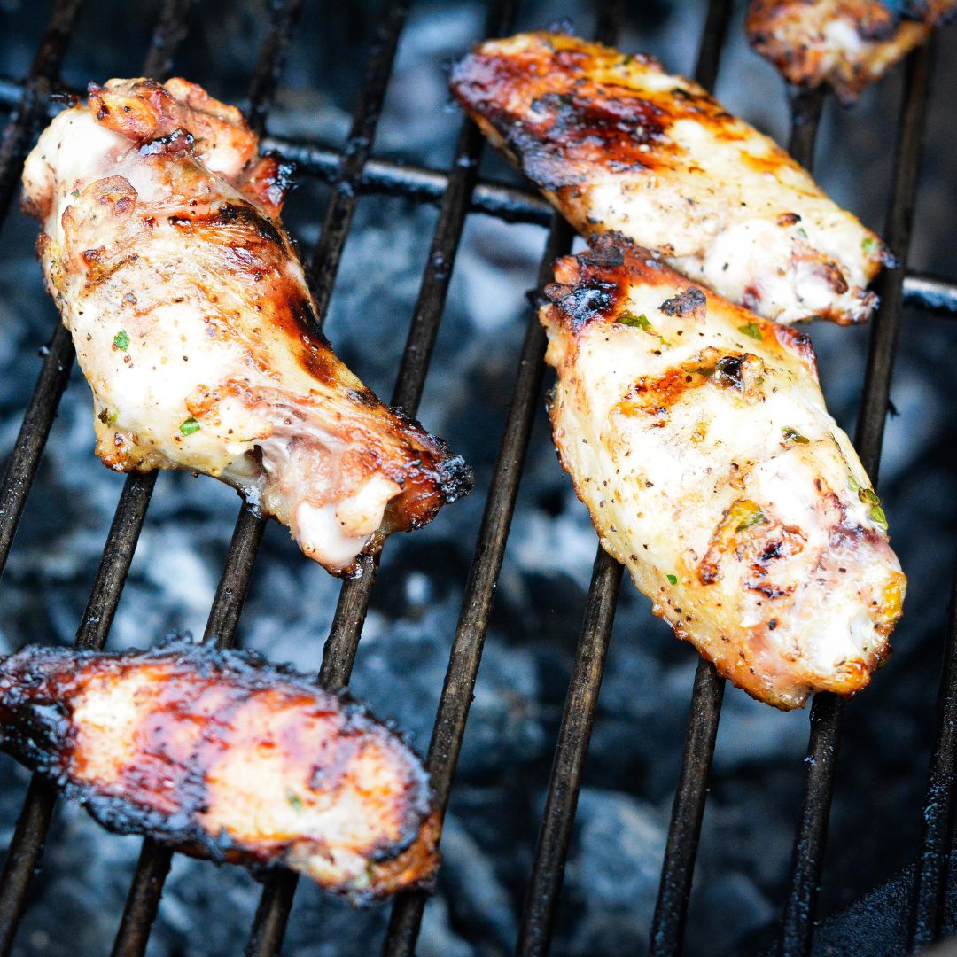 Then, increase the heat to 350°F (or finish on a grill). Remove from the grill and brush the wings with the lemon garlic butter or honey mustard sauce.