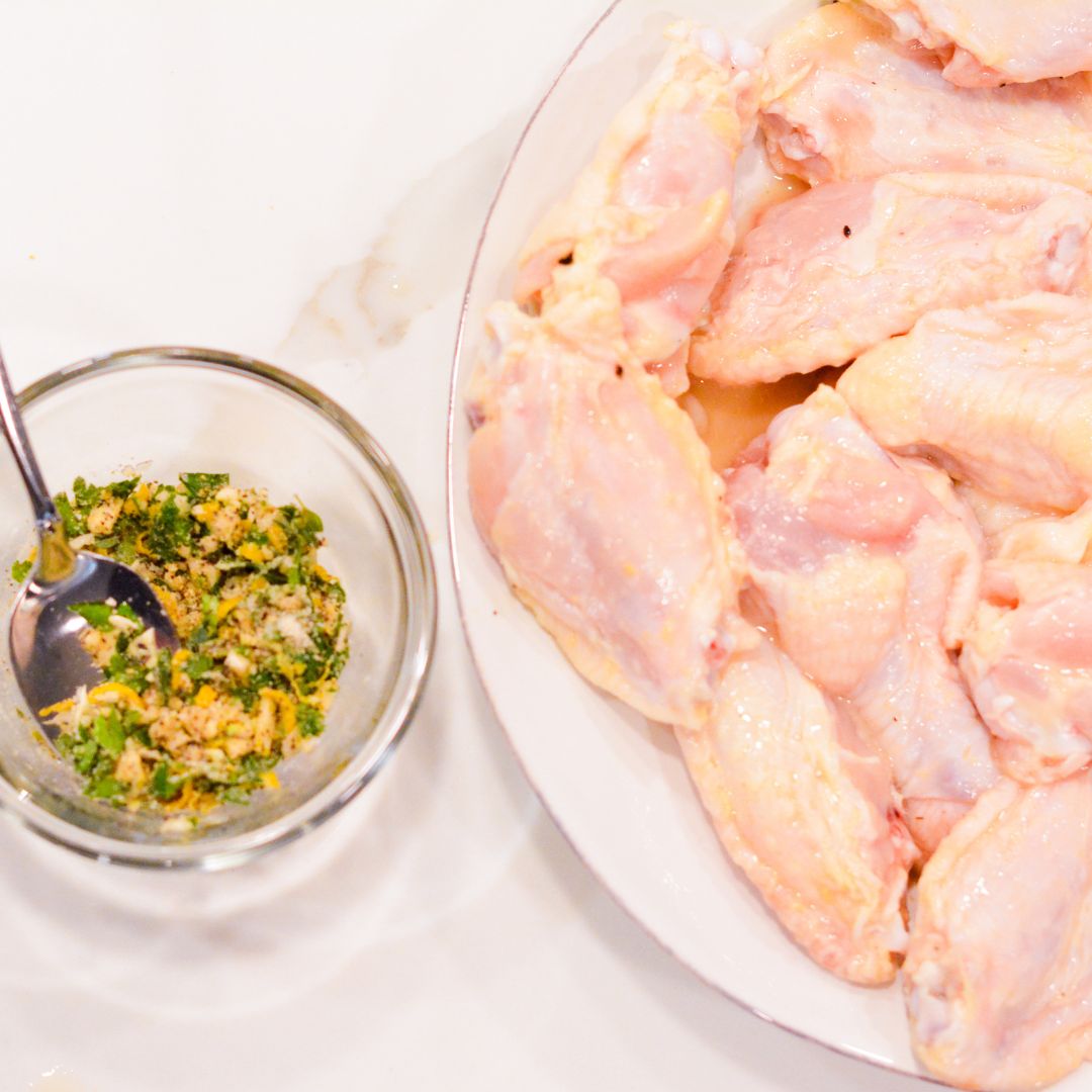 Make Lemon Pepper Dry Rub—While the wings are marinating and the smoker is heating up, combine lemon pepper seasoning with black pepper, minced garlic, lemon peel, and parsley, optionally.