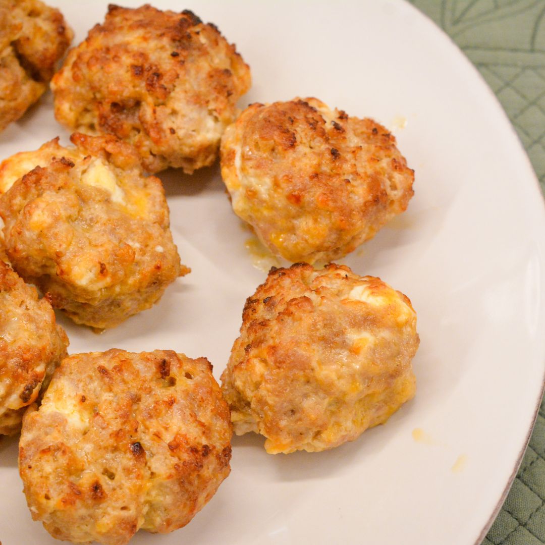 Make these delicious Air Fryer Sausage Balls with ground pork, cream cheese, Colby Jack, Parmesan, and breakfast sausage seasoning for a quick and high protein breakfast.