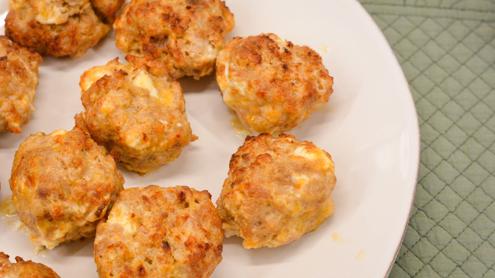 Make these delicious Air Fryer Sausage Balls with ground pork, cream cheese, Colby Jack, Parmesan, and breakfast sausage seasoning for a quick and high protein breakfast.