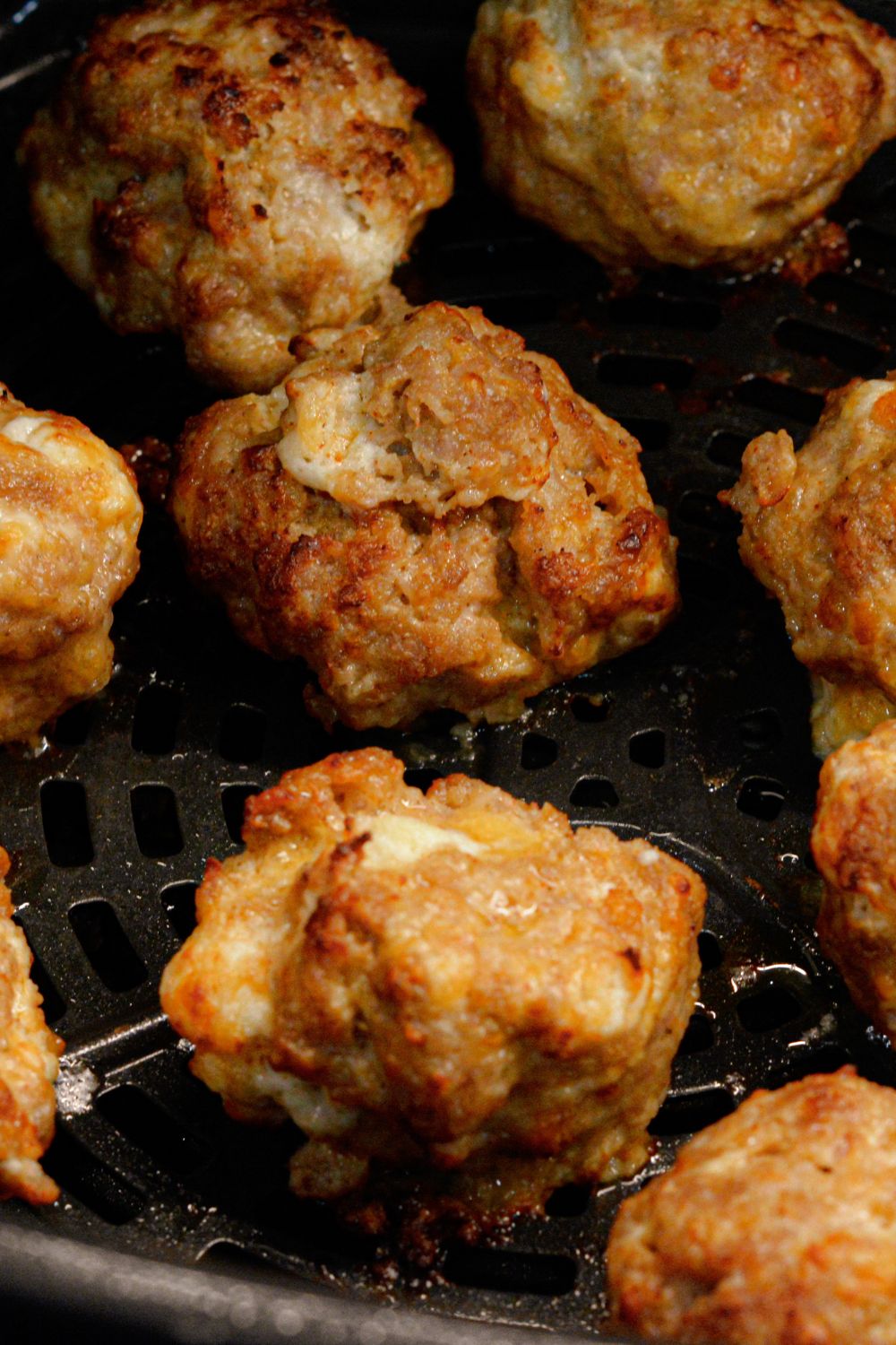 Make these delicious Air Fryer Sausage Balls with ground pork, cream cheese, Colby Jack, Parmesan, and breakfast sausage seasoning for a quick and high protein breakfast.