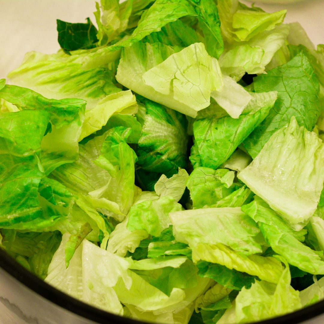 Lay the lettuce on the bottom of the bowl.