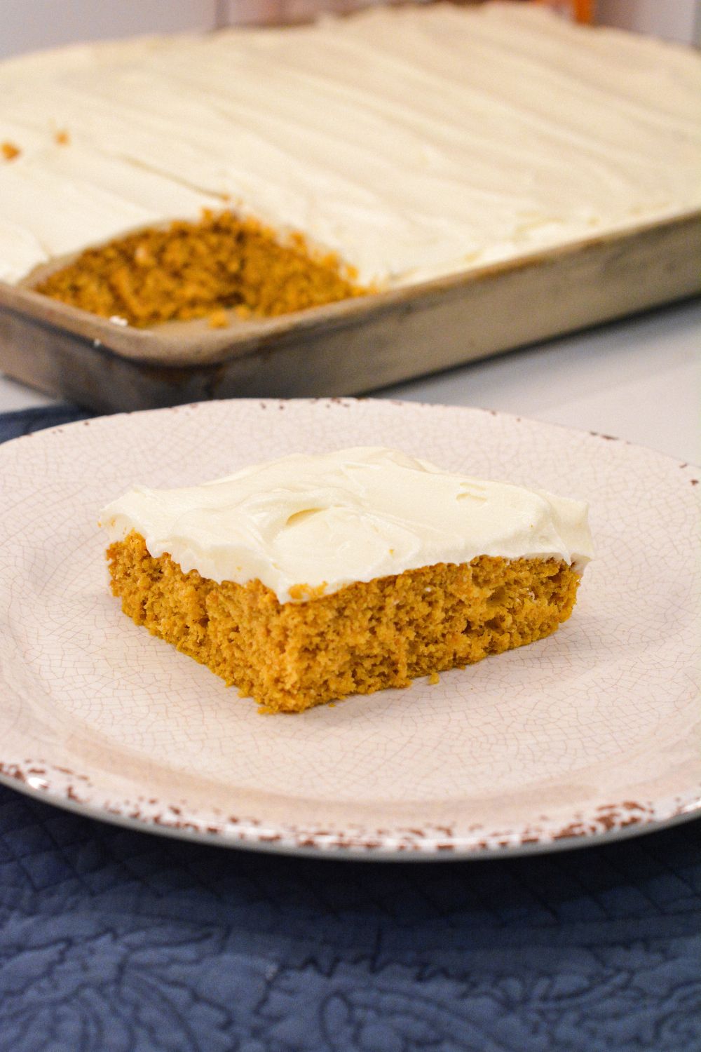 Moist, spiced, and topped with the creamiest frosting, these cake mix Pumpkin Bars with cream cheese frosting are a must-try fall dessert! Made with pumpkin puree and a box of spice cake mix, they’re simple to whip up and perfect for any gathering. Baked in a 10x15-inch pan for the ideal shareable treat.