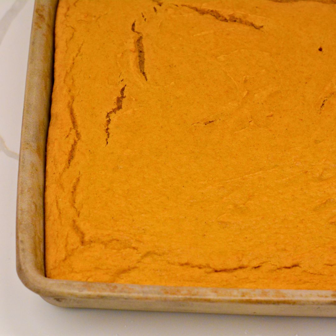 Remove cake mix pumpkin bars from the oven and allow the bars to cool completely in the pan.