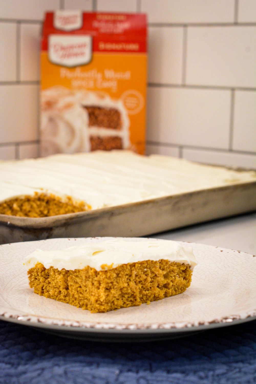 Moist, spiced, and topped with the creamiest frosting, these cake mix Pumpkin Bars with cream cheese frosting are a must-try fall dessert! Made with pumpkin puree and a box of spice cake mix, they’re simple to whip up and perfect for any gathering. Baked in a 10x15-inch pan for the ideal shareable treat.