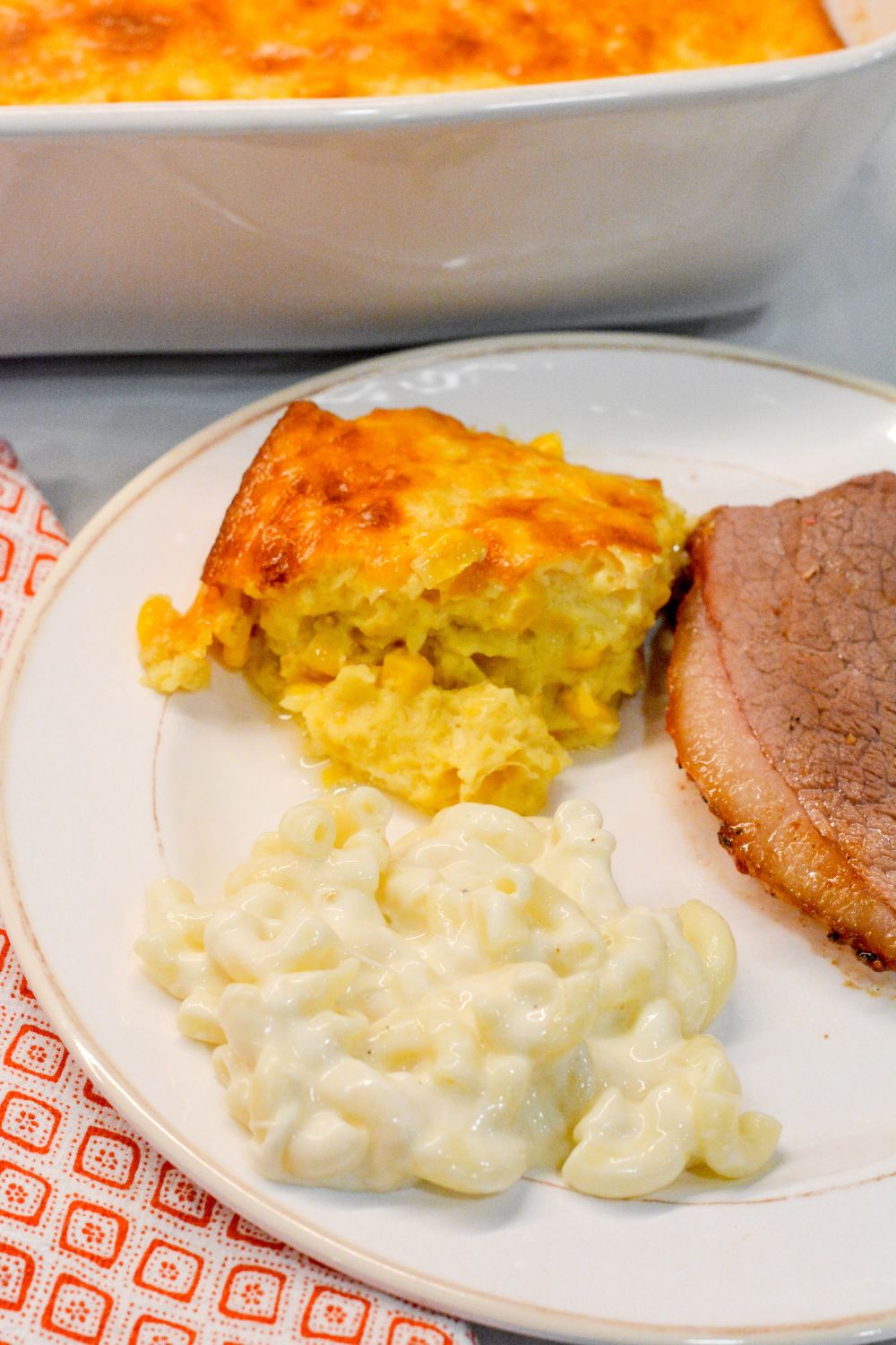 This homemade corn pudding is the ultimate side dish! Made with creamed corn, kernel corn, cornstarch, and evaporated milk, it's creamy, comforting, and easy to make—no box mix required! 