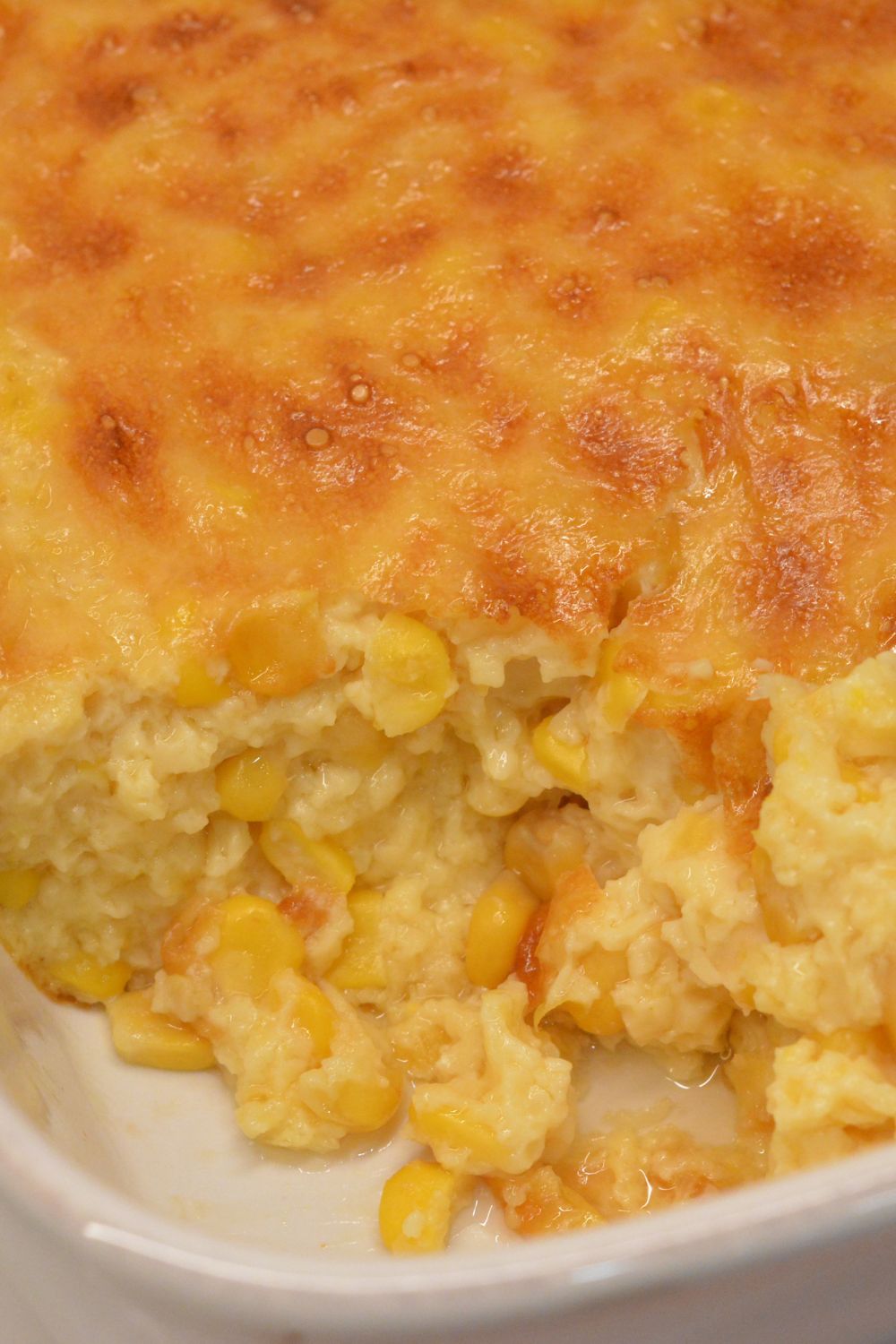 This homemade corn pudding is the ultimate side dish! Made with creamed corn, kernel corn, cornstarch, and evaporated milk, it's creamy, comforting, and easy to make—no box mix required!